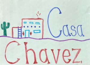 casa chavez with an adobe house next to a cactus